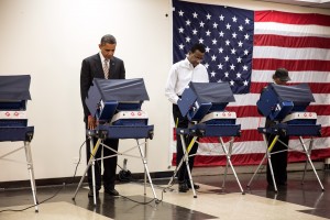 President Barack Obama casts his ballot during early voting at the Martin Luther King Jr. Community Center in Chicago, Ill., Oct. 25, 2012. (Official White House Photo by Pete Souza) This official White House photograph is being made available only for publication by news organizations and/or for personal use printing by the subject(s) of the photograph. The photograph may not be manipulated in any way and may not be used in commercial or political materials, advertisements, emails, products, promotions that in any way suggests approval or endorsement of the President, the First Family, or the White House.